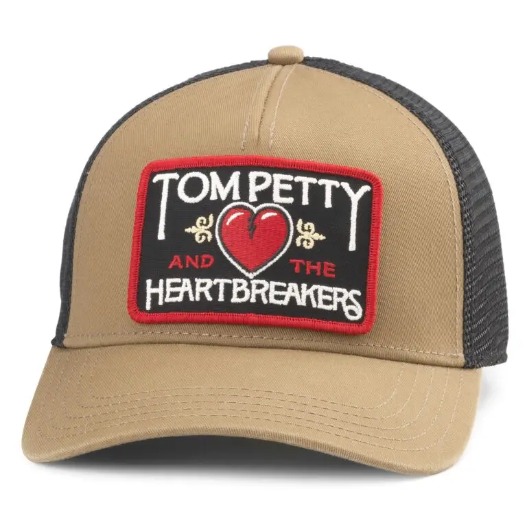 Tan and black trucker hat featuring Tom Petty & the Heartbreakers embroidered patch