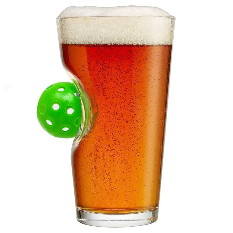 Pickleball-themed pint glass with embedded green pickleball in the side